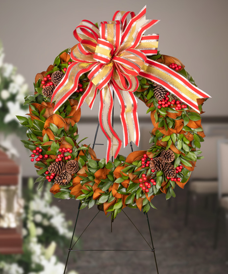 Magnolia, Pinecone, and Berry Sympathy Wreath on Easel